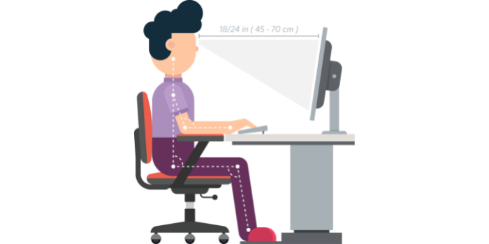 a person sitting at an ergonomic desk